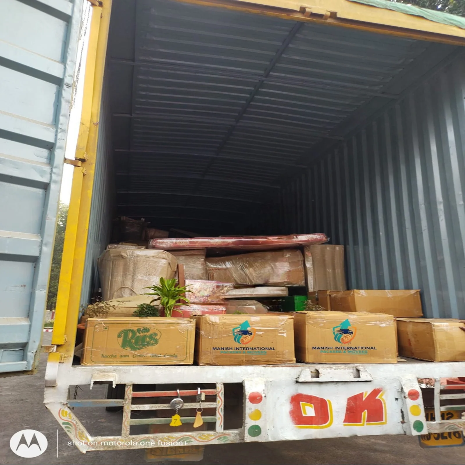Moving team safely loading packed goods